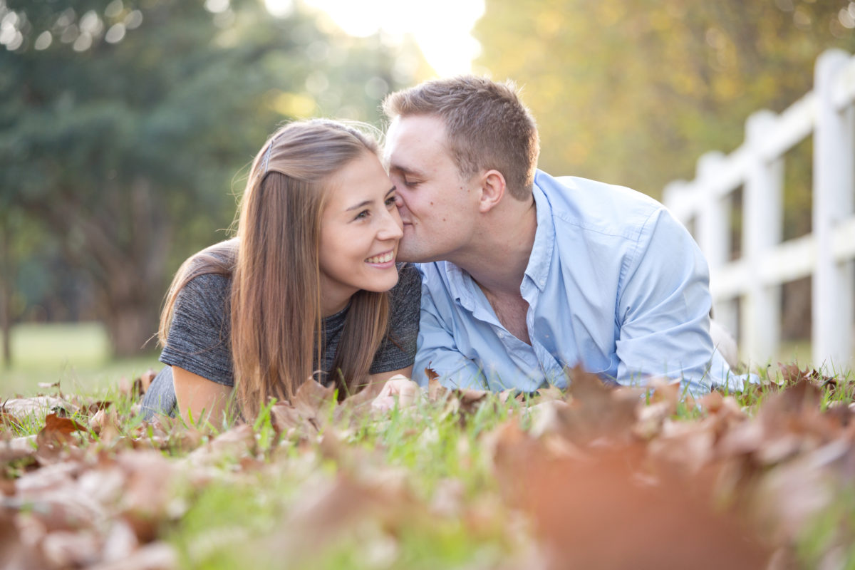 autumn delight rustic engagement shoot kissing his fiance